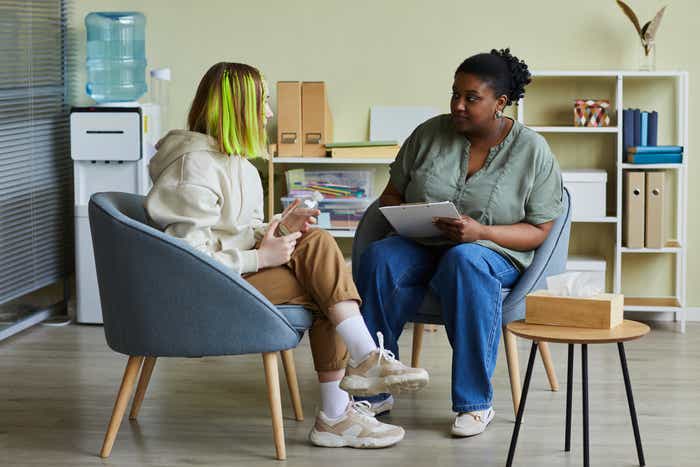 Mental health worker chatting with a young person
