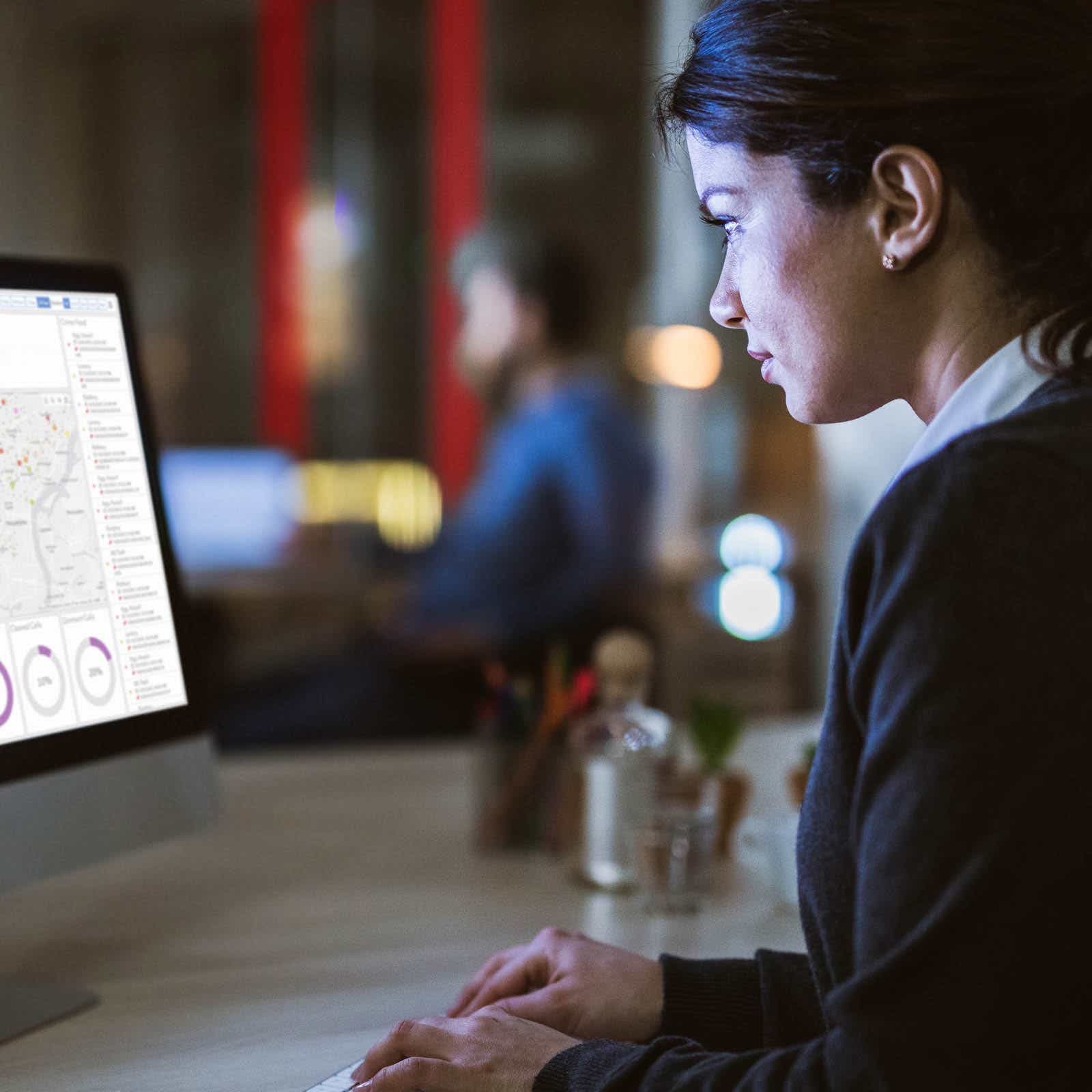 business analyst typing on computer