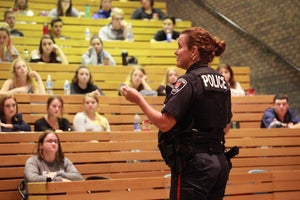 police officer presenting to students