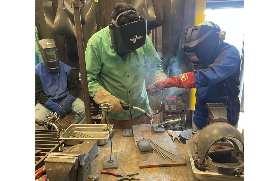 students welding