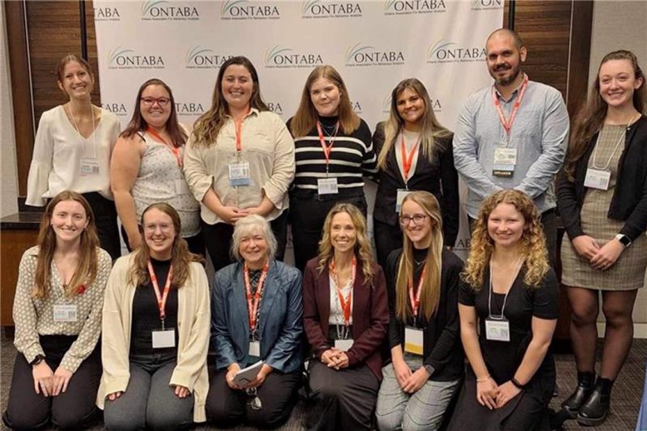 SLC students and faculty at conference