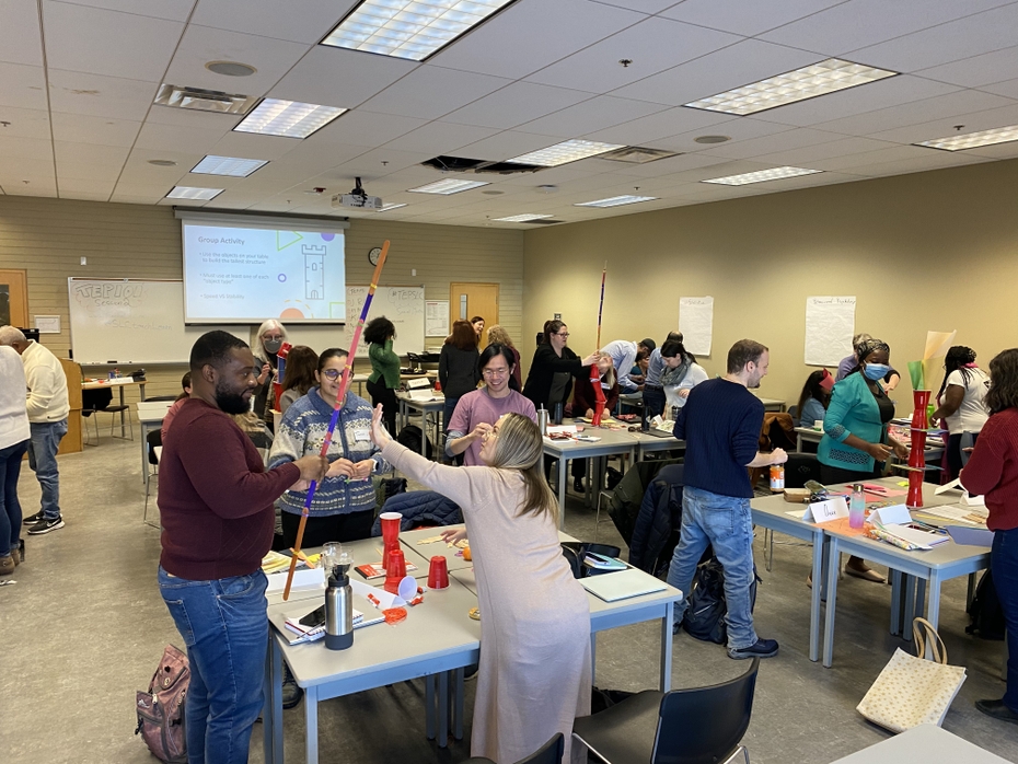 Participants in the Teaching Effectiveness Program work on a team building activity.