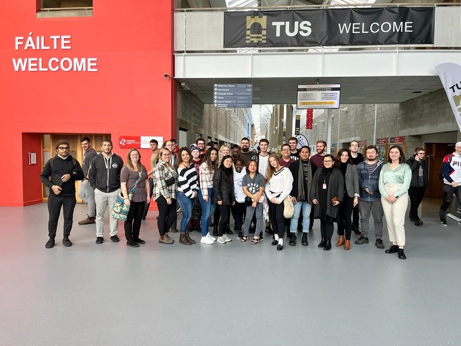 A group of students stand in the main entrance of Technological University of the Shannon (TUS) in Ireland