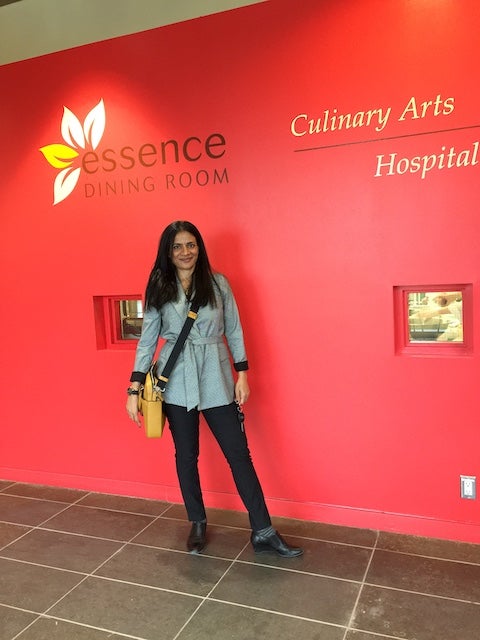 Rajita stands in front of the SLC Culinary lab