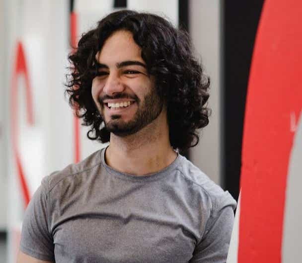 A male student smiling