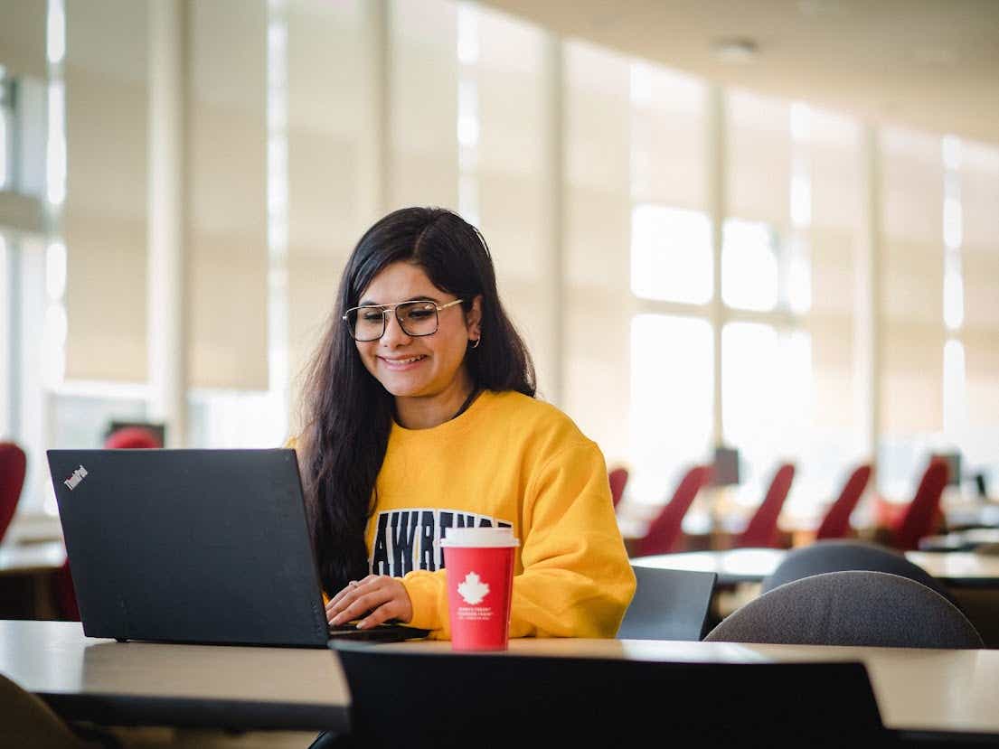 Student studying with a Tim Hortons Coffee