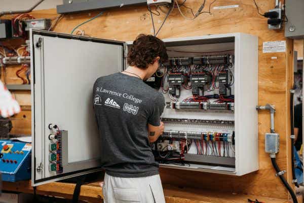 electrical student working at panel